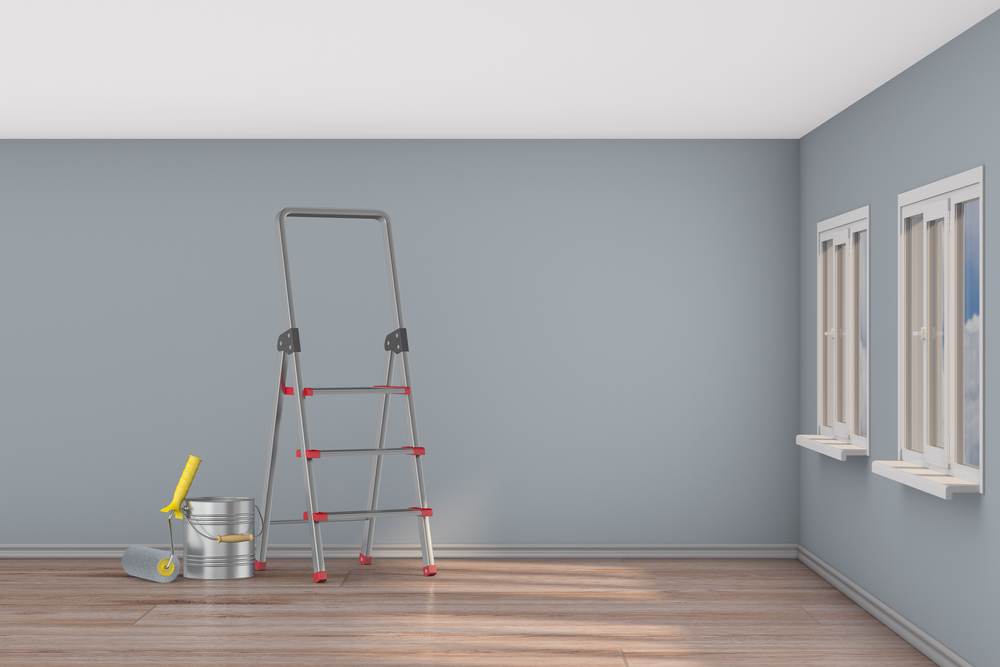 Freshly painted room with step ladders in the center
